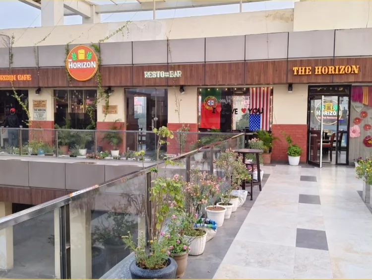 The Horizon's entrance on the open walkway of 83 Avenue Mall
