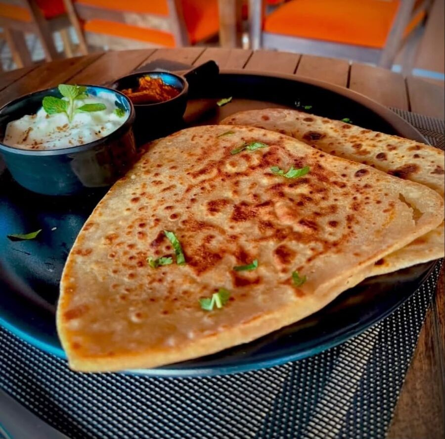 Tawa parantha with pickle and curd