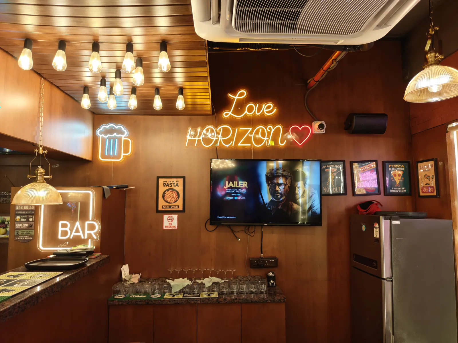 The Love Horizon neon above the bar